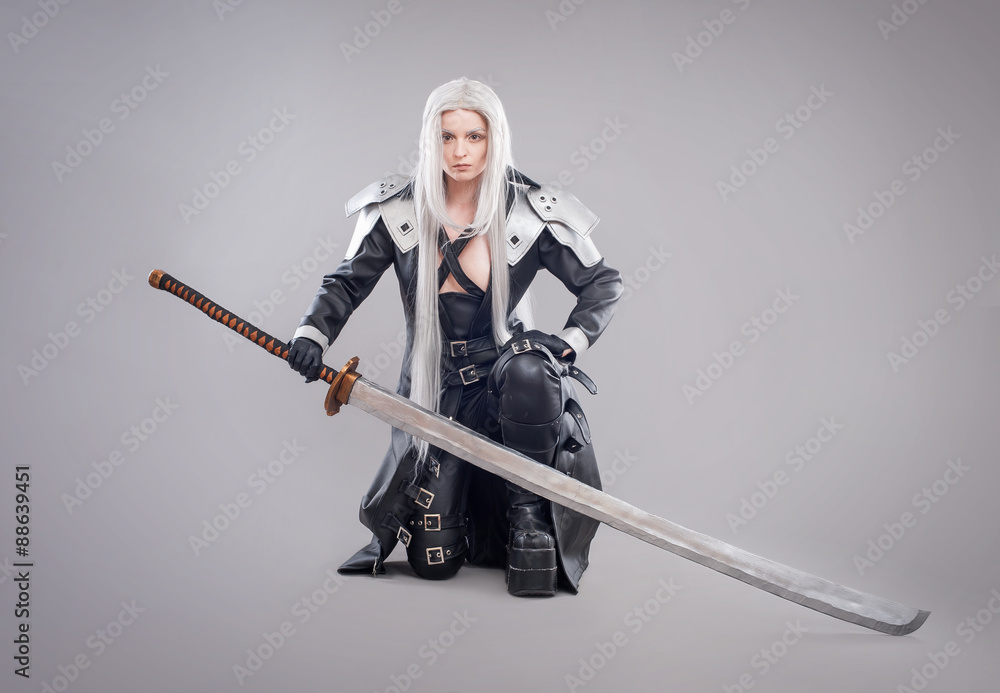 Fantasy woman warrior / Woman warrior with sword and armor isolated on the gray background Fantasy woman warrior / Woman warrior with sword and armor isolated on the gray background