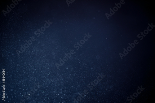 abstract dark bokeh lights background ,  defocused background, glowing galaxy
