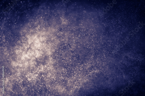 abstract dark bokeh lights background , defocused background, glowing galaxy