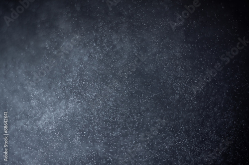 abstract dark bokeh lights background ,  defocused background, glowing galaxy