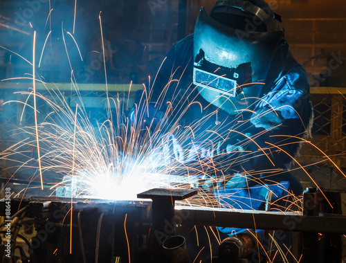 Industrial steel welder in factory