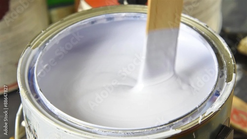 Stirring a gallon of paint slow motion
