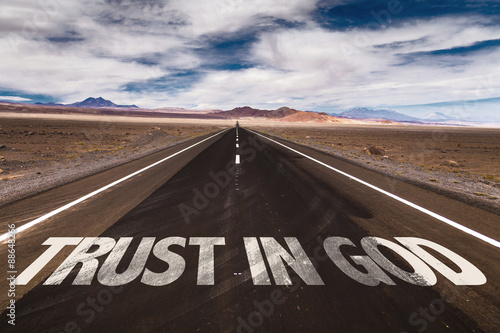 Trust in God written on desert road
