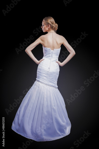 Portrait of Caucasian Bride Posing in Gorgeous Wedding Dress Mad