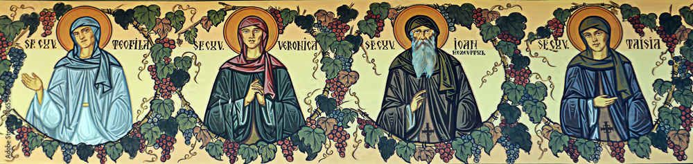 Saints painted on wall frieze outside Orthodox church, Bucharest