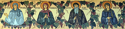 Saints painted on wall frieze outside Orthodox church, Bucharest