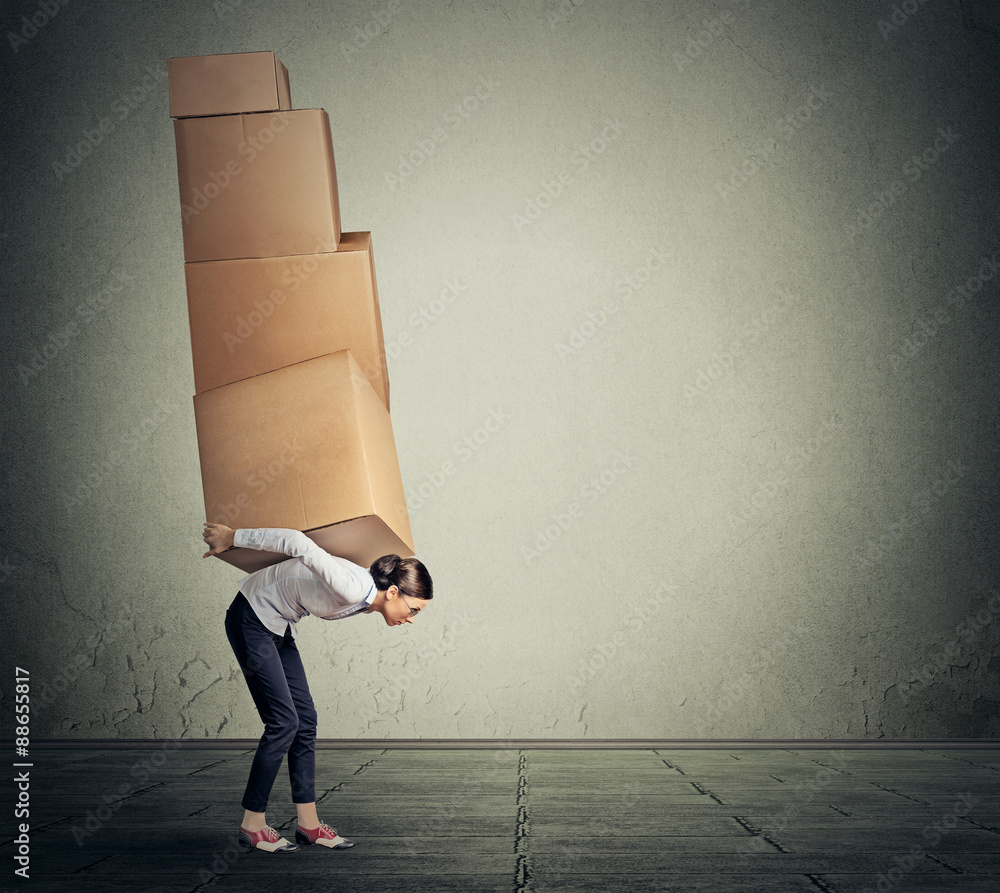 girl holding carrying several boxes on her back in equilibrium Stock ...