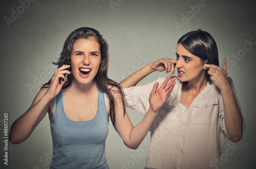 two women loud, obnoxious rude woman talking loudly on cell phone