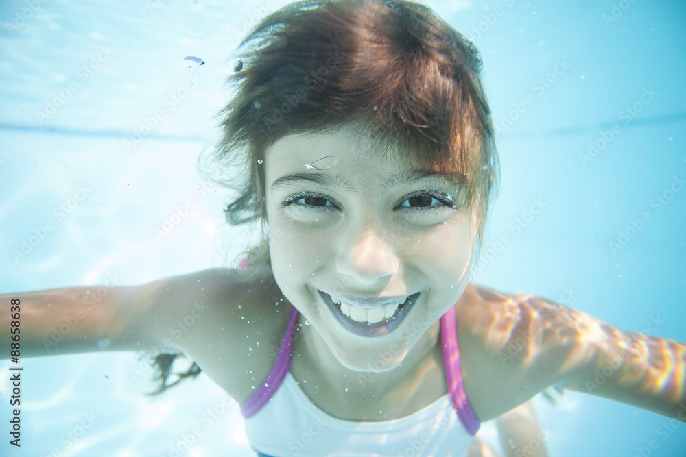 Joyful girl swimming underwater in pool Stock Photo Adobe Stock