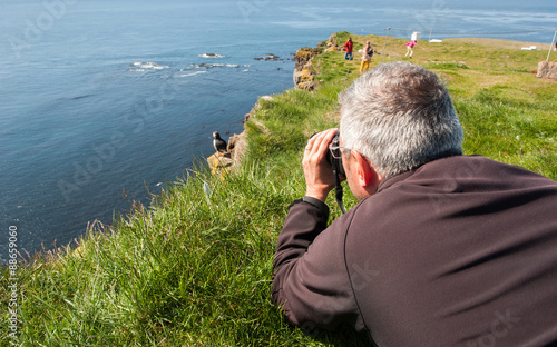 Photographing puffins at Latrabjarg Cliff, Iceland