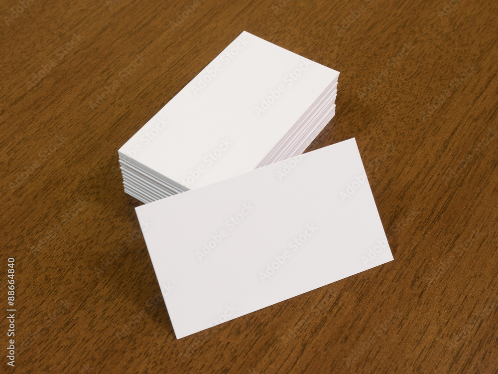 Empty business cards on a wooden desk background Empty business cards on a wooden desk background