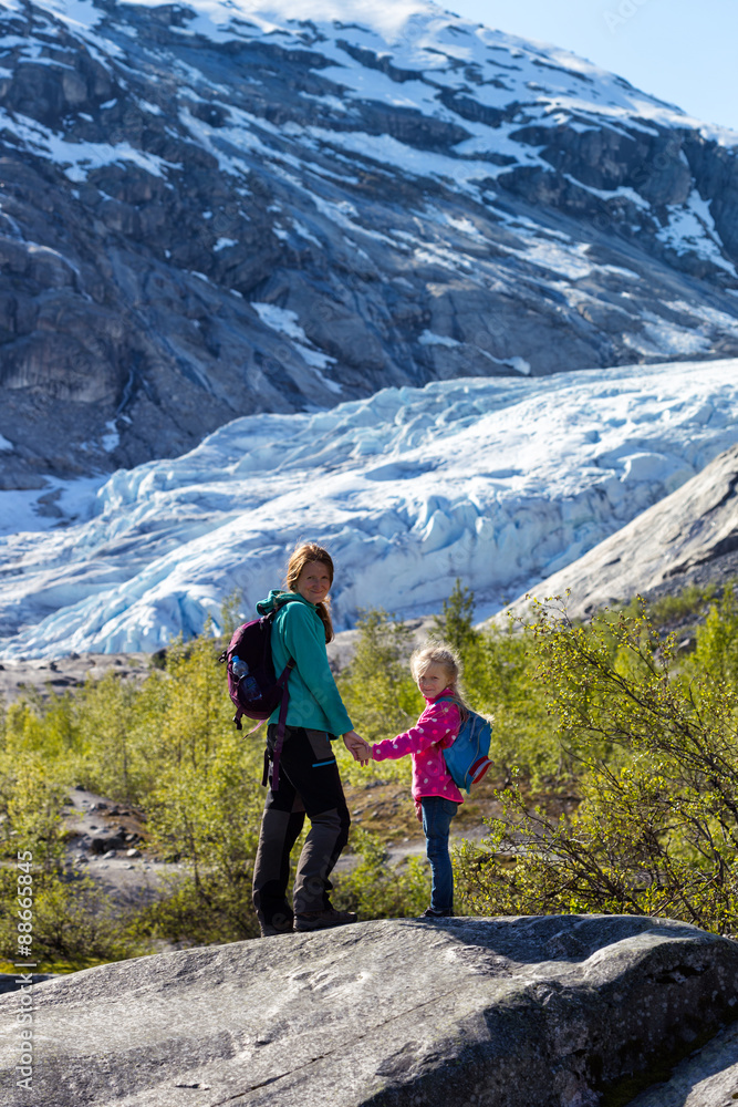 girls against the backdrop of a glacier