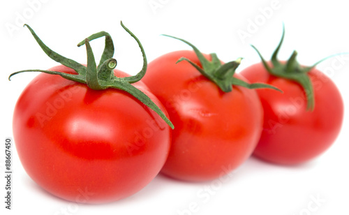 ripe tomatoes on a white background