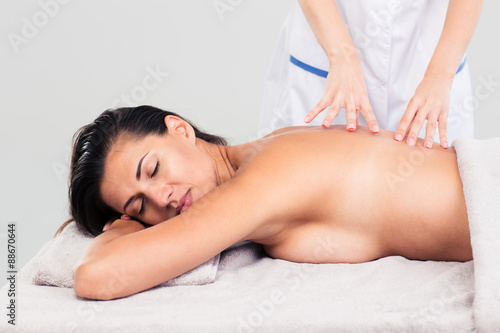 Woman lying on massage lounger