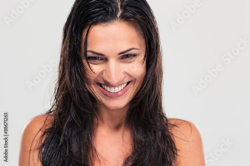 Portrait of a happy cute woman with wet hair