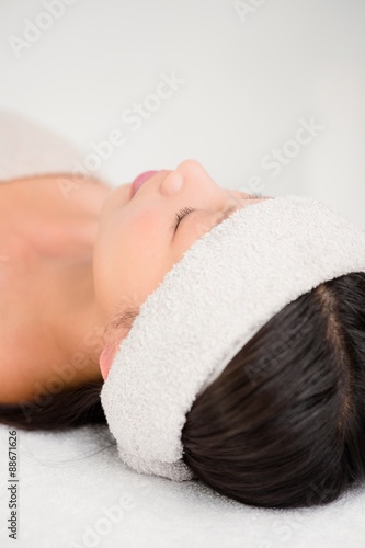 Relaxed woman lying on the massage table