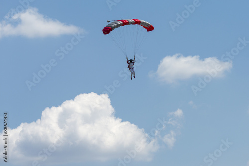 Paraglider flying in summer day