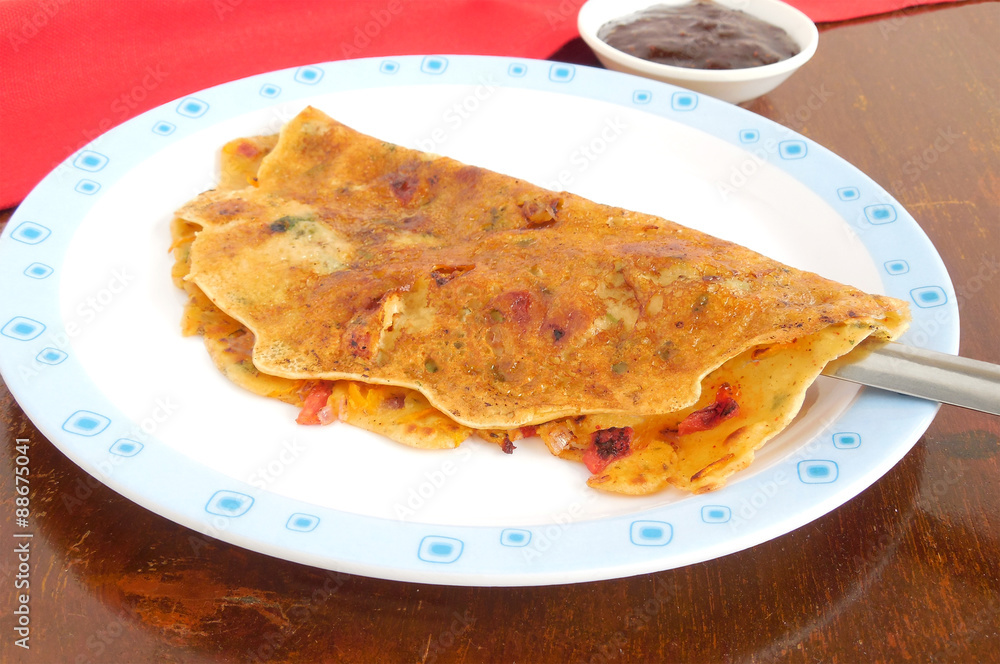 Besan Chilla, an Indian vegetarian dish, similar to a dosa, pancake or vegetable omelet. 