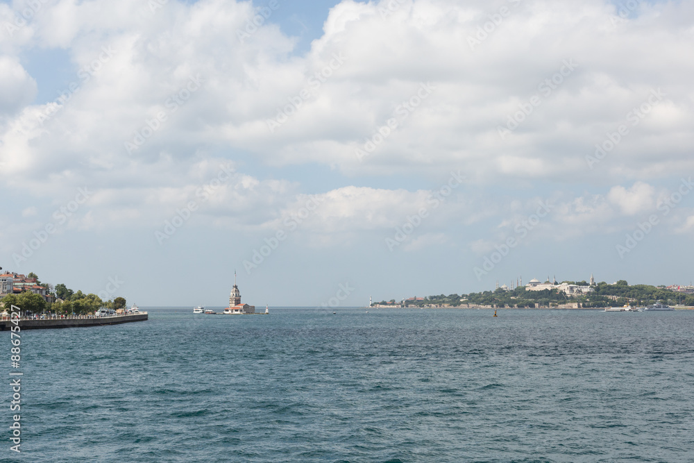 the mouth of the Bosphorus straits in Istanbul, Turkey with Leander's tower (Kız Kulesi) and the Saray Burnu in the distance