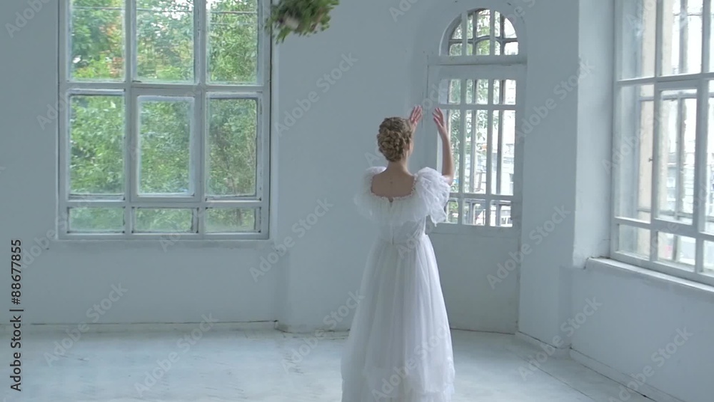 Beautiful girl in white dress throw back the bouquet, slow Beautiful girl in white dress throw back the bouquet, slow