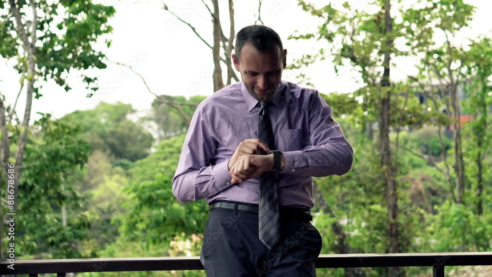 Young businessman with smartwatch standing on terrace
Young businessman with smartwatch standing on terrace