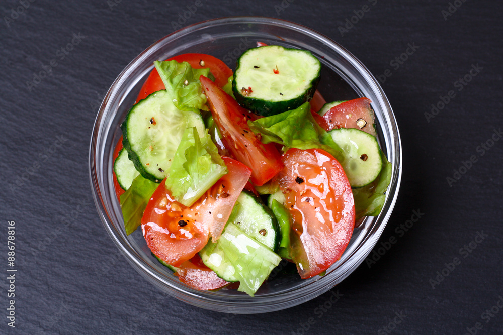 Fresh salad with tomatoes, cucumbers and lettuce