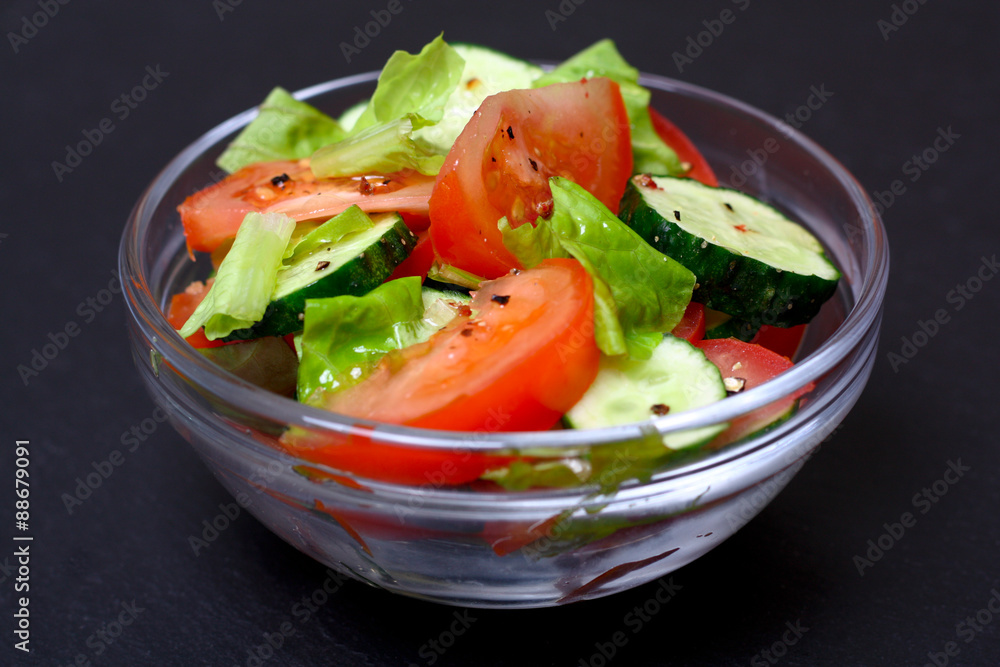 Fresh salad with tomatoes, cucumbers and lettuce Fresh salad with tomatoes, cucumbers and lettuce