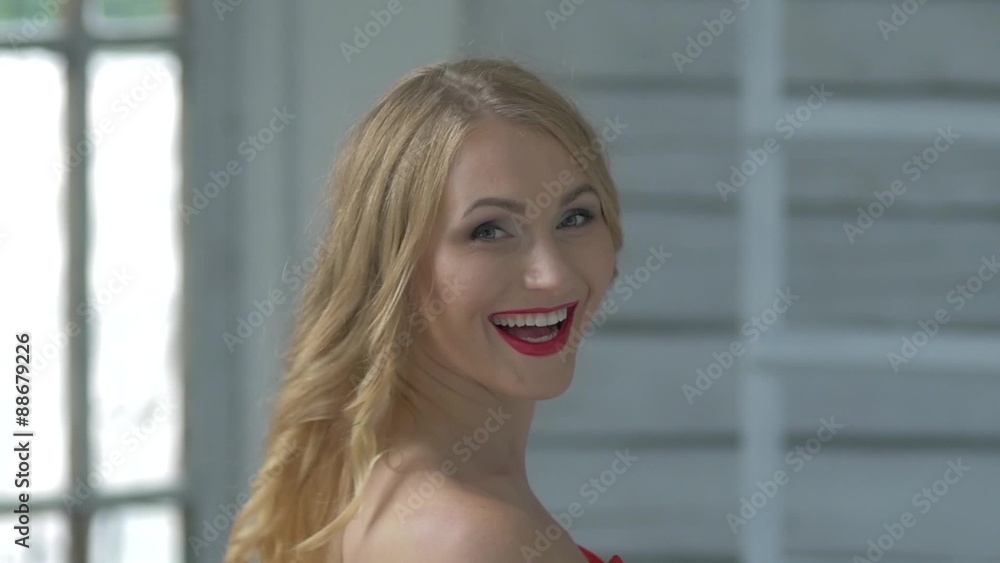 Young cute smiling girl waves her hair, slow motion Young cute smiling girl waves her hair, slow motion