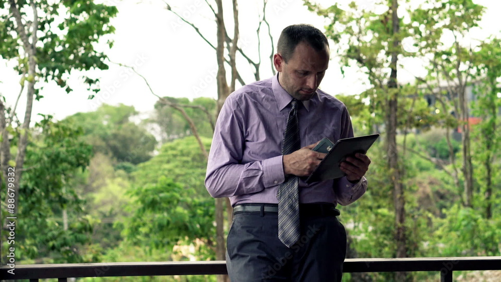 Businessman comparing data on smartphone and tablet computer standing on terrace
Businessman comparing data on smartphone and tablet computer standing on terrace