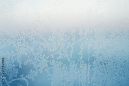 Patterns frost on the glass close-up photo