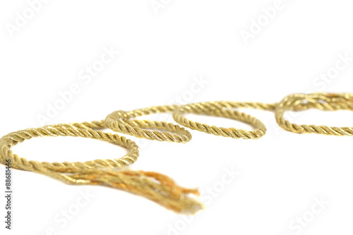 Golden rope isolated on white background