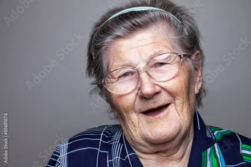 Portrait of an elderly woman with glasses photo