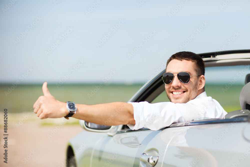 happy man driving car and showing thumbs up happy man driving car and showing thumbs up