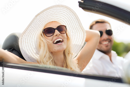 happy man and woman driving in cabriolet car © Syda Productions