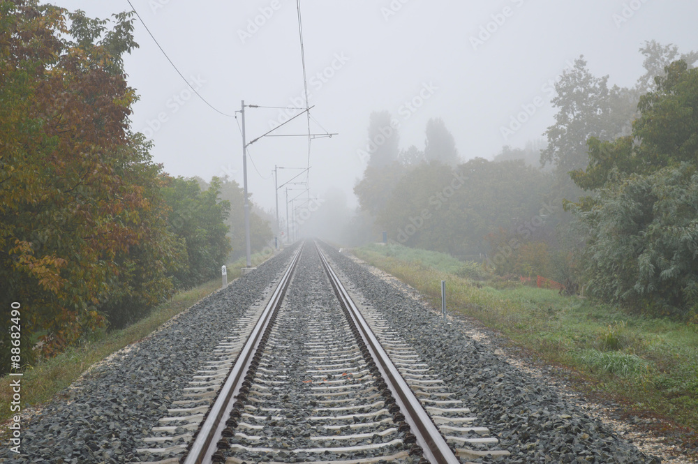 Railway track line in mist