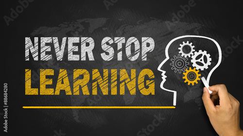 never stop learning concept on blackboard photo