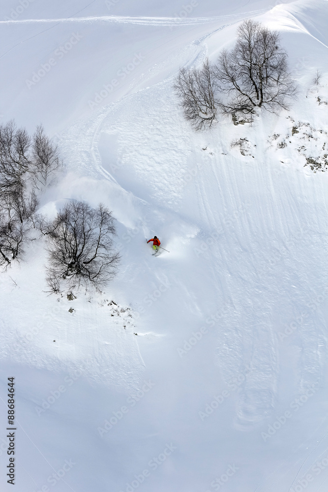 Skier in deep powder, extreme freeride Skier in deep powder, extreme freeride
