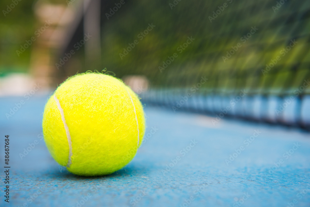tennis ball on a tennis court with net