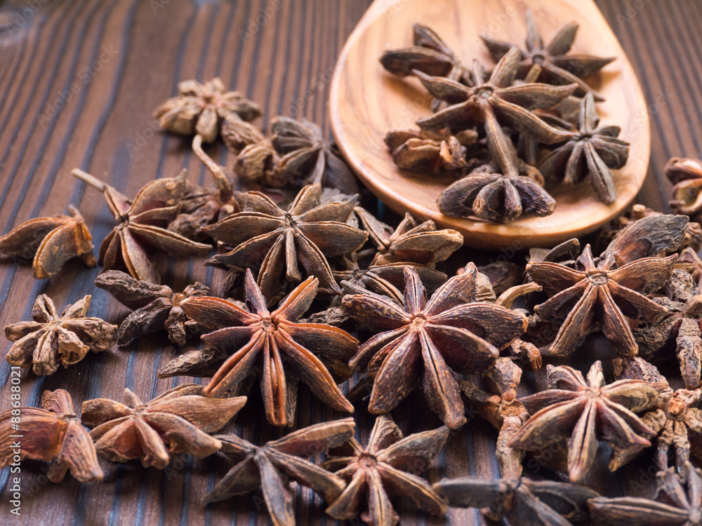 Star anise in the wooden spoon Star anise in the wooden spoon