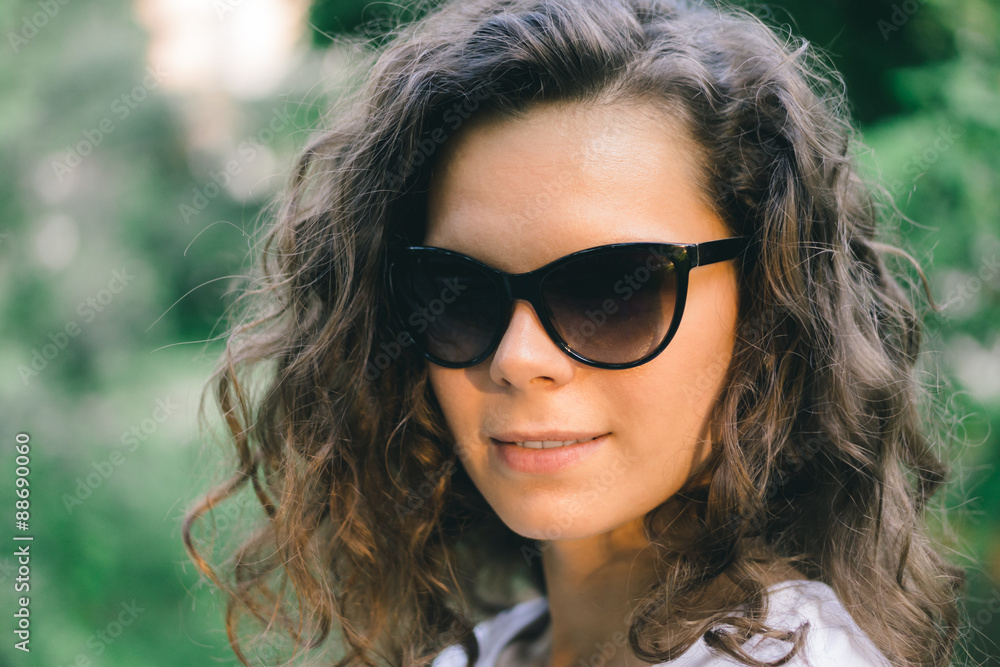 Portrait of a young pretty girl in the summer in the park for a Portrait of a young pretty girl in the summer in the park for a