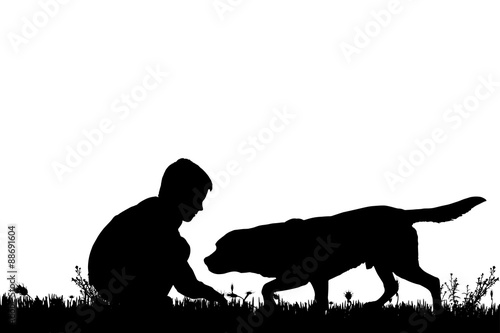 Vector silhouette of a boy with a dog.