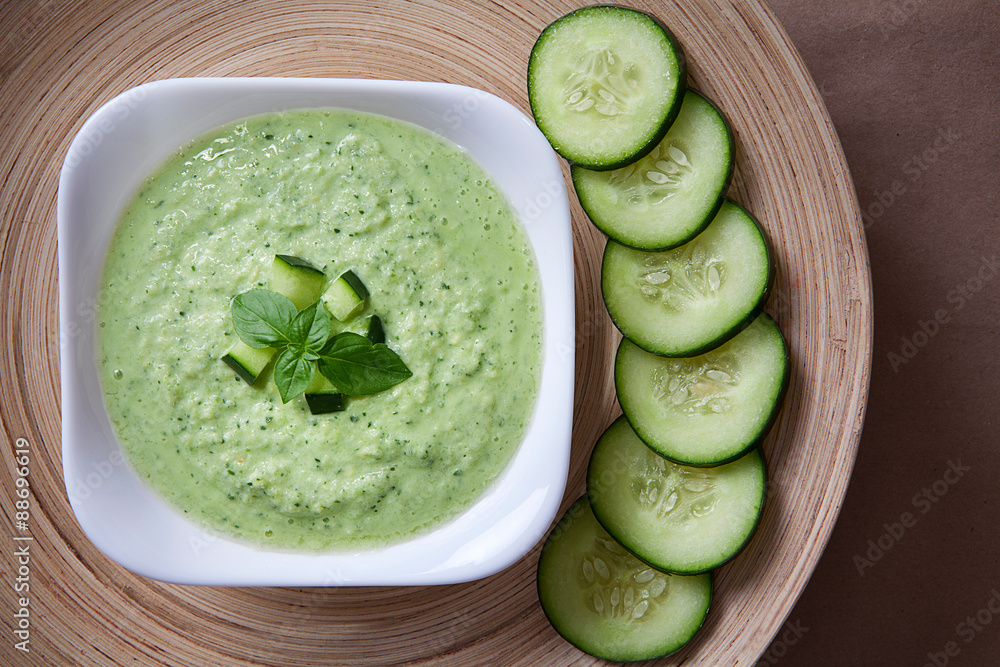 Plate of green cold soup Plate of green cold soup