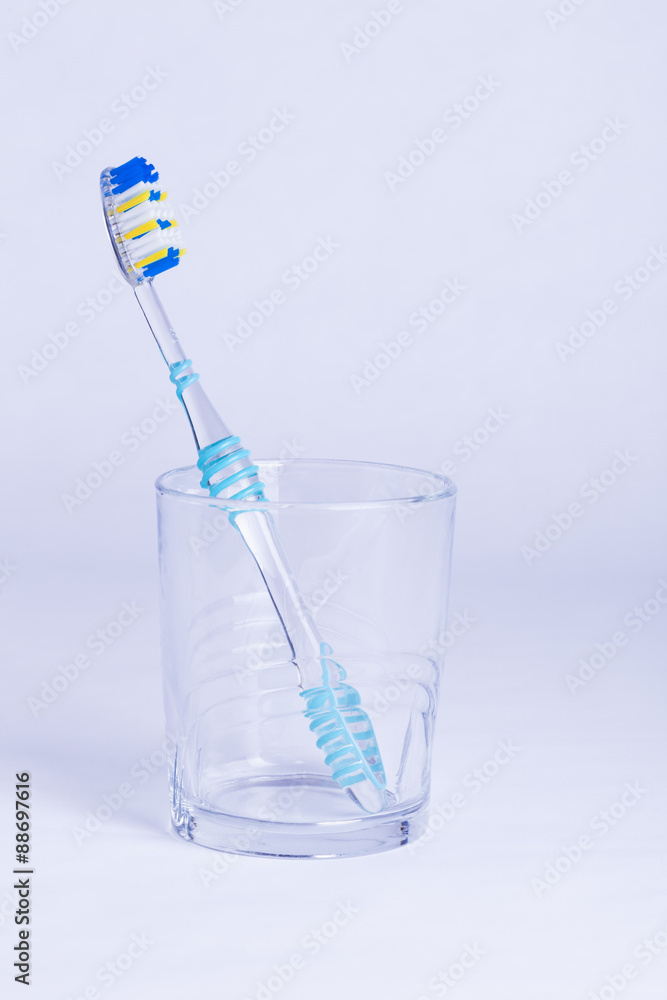 Single toothbrush in glass Single toothbrush in glass