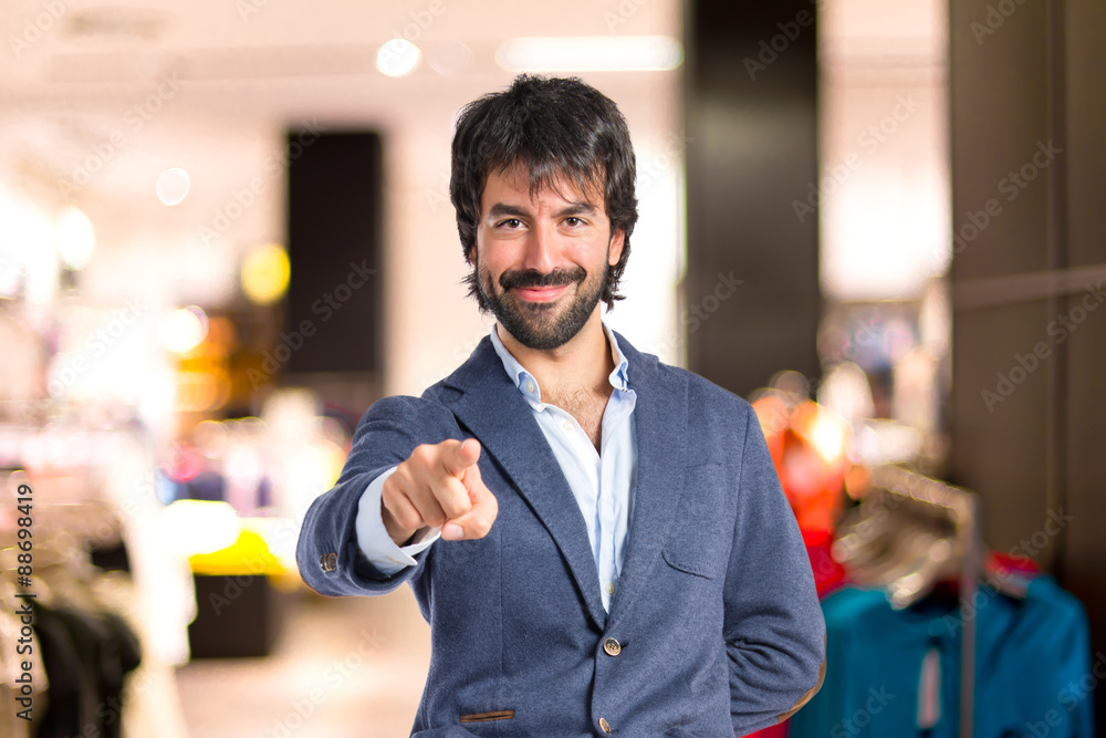 Man pointing to the front over white background Man pointing to the front over white background