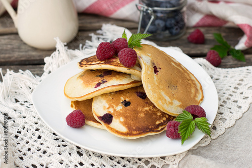 Homemade pancakes with raspberries and blueberries photo