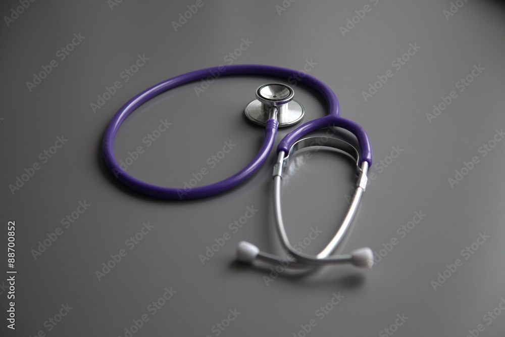 Stethoscope on the grey desk, close up Stethoscope on the grey desk, close up