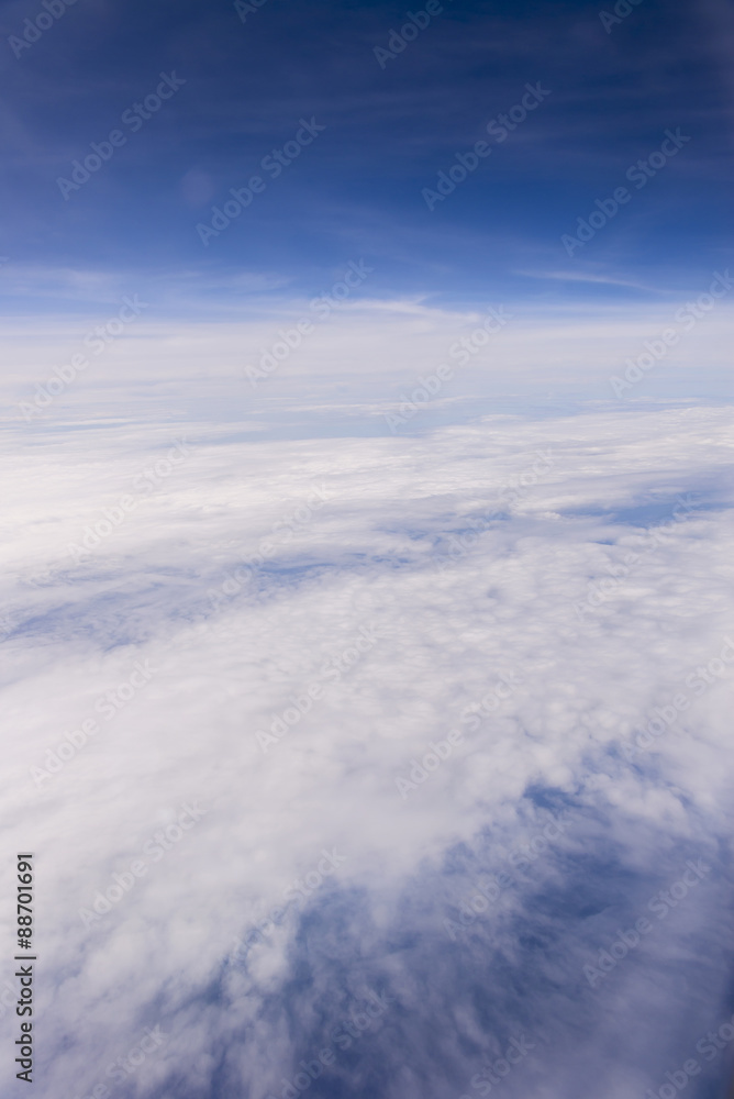 clouds sky . view from the window of an airplane flying in the c clouds sky . view from the window of an airplane flying in the c