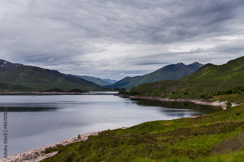 Lake and mountains in cloudy day, Scotland landscape