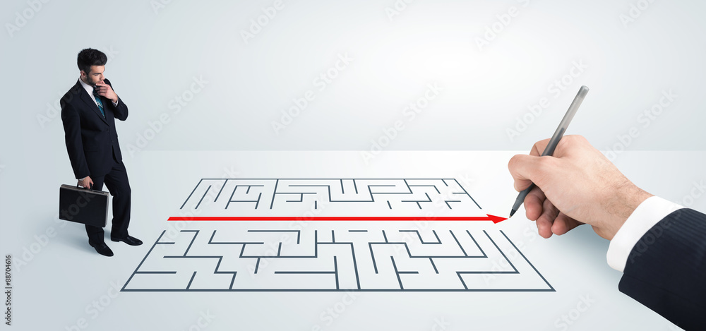 Business man looking at hand drawing solution for maze Business man looking at hand drawing solution for maze
