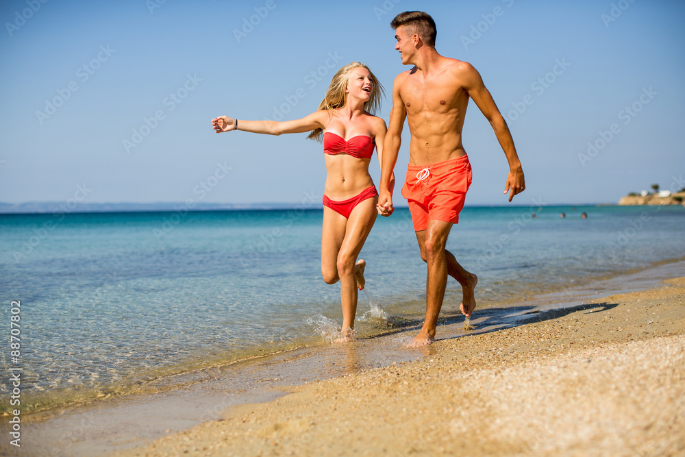 Young couple relaxing on the beach Young couple relaxing on the beach